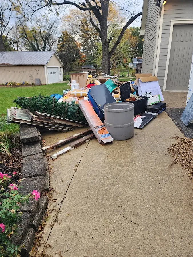 Dumpster being loaded with debris for 30 Yard Dumpster Rental in Larkin